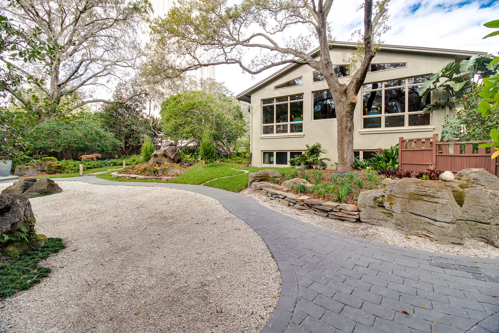 Winding garden pathway leading to the retreat house